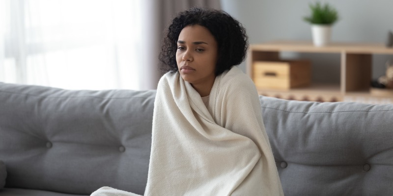 Woman wrapped up in blanket