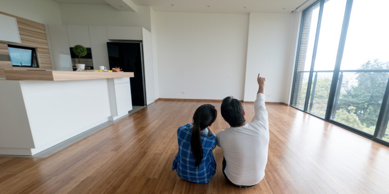 Couple sitting on the floor in their new home